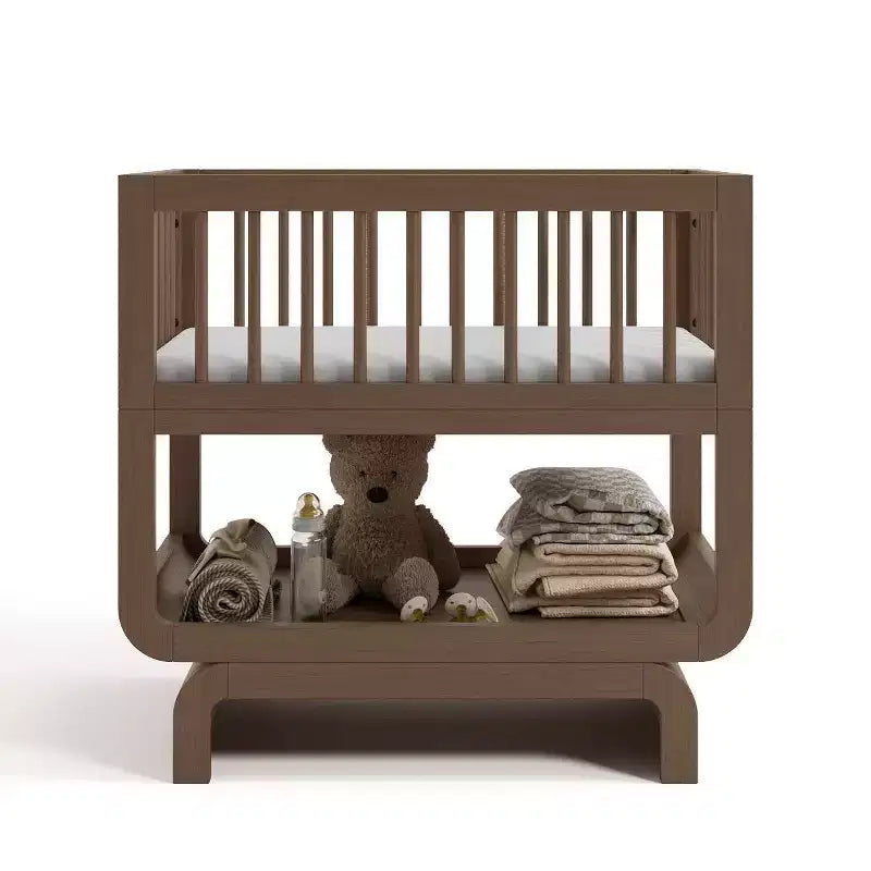 Berceau et coffre à jouets convertibles