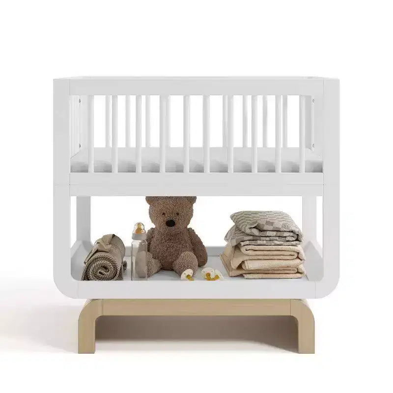 Berceau et coffre à jouets convertibles